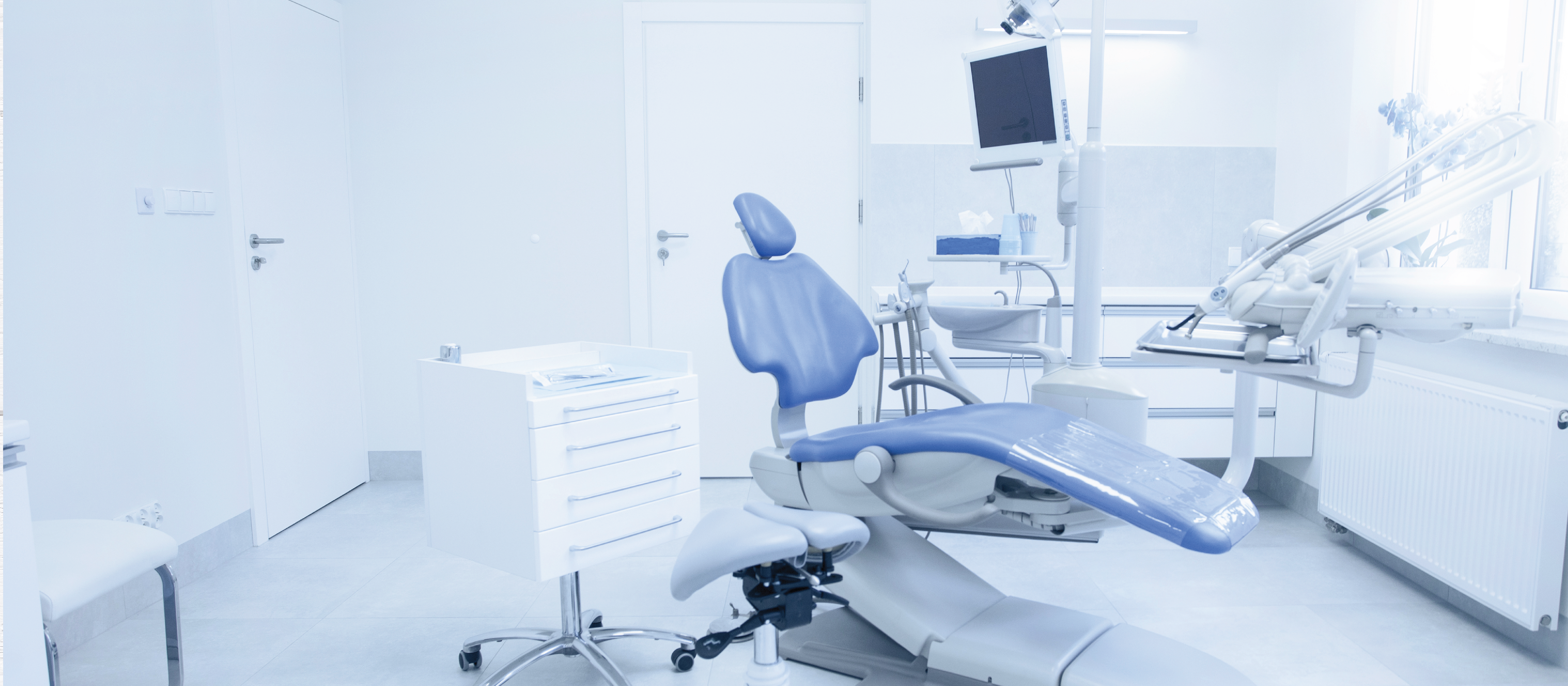 blue dental chair in dental office